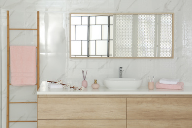 Photo of Large mirror over vessel sink in stylish bathroom interior