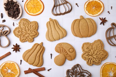 Flat lay composition with tasty cookies and cutters on white table