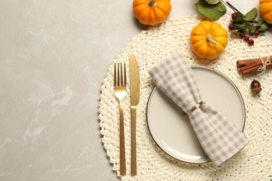 Photo of Stylish autumn table setting on light background, flat lay. Space for text