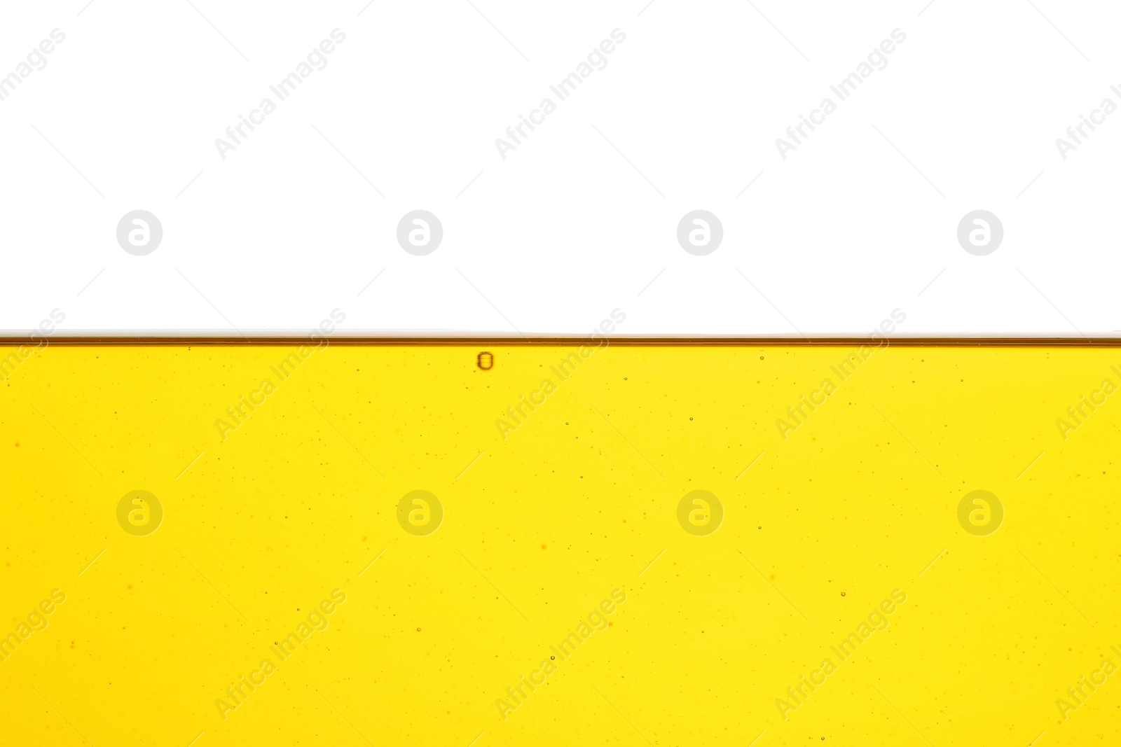 Photo of Cooking oil flow isolated on white. Color liquid
