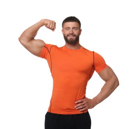 Photo of Young bodybuilder showing his muscular arm on white background