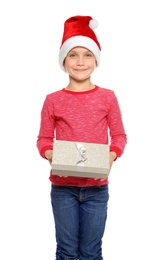 Cute little child in Santa hat with Christmas gift box on white background