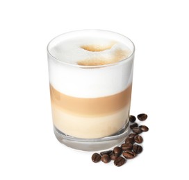 Photo of Delicious latte macchiato and coffee beans on white background