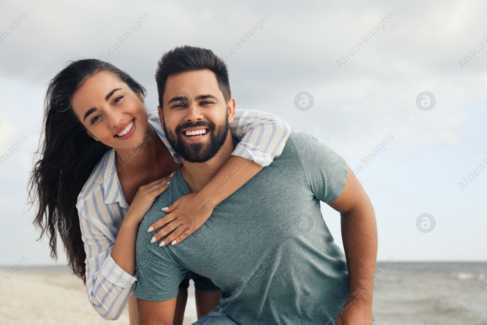 Photo of Lovely couple spending time together on beach