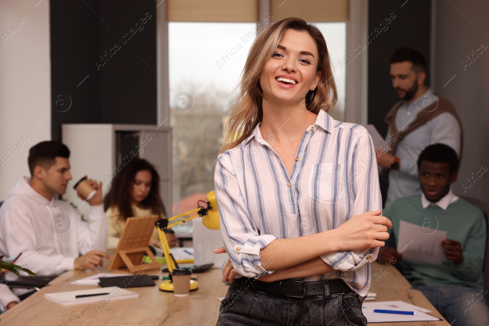 Photo of Portrait of happy young woman in office, space for text. Startup project
