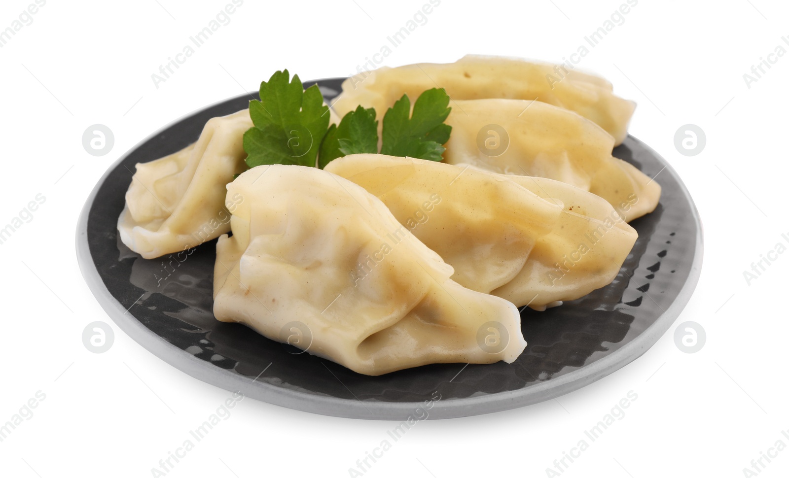 Photo of Delicious gyoza (asian dumplings) with parsley isolated on white