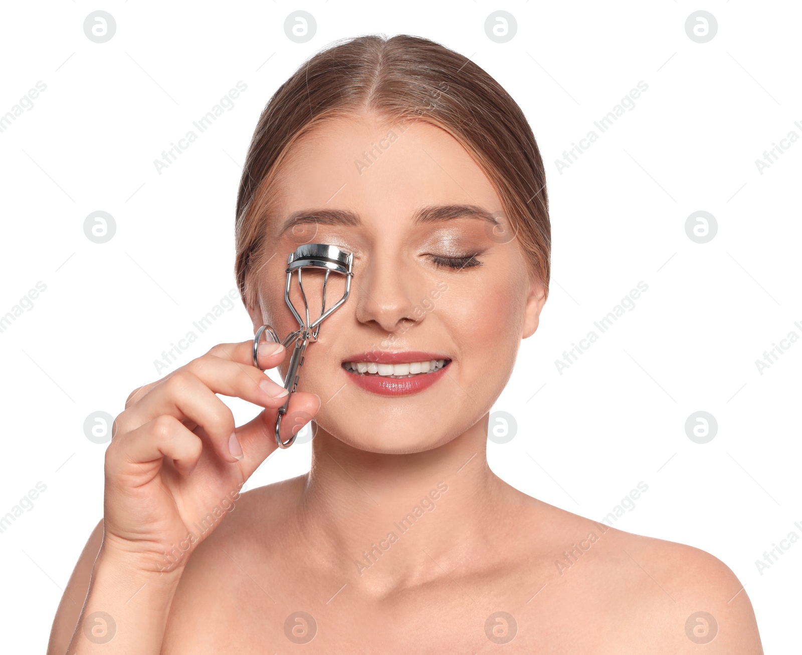 Photo of Young woman with eyelash curler on white background