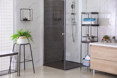 Photo of Bathroom interior with shower stall and counter. Idea for design