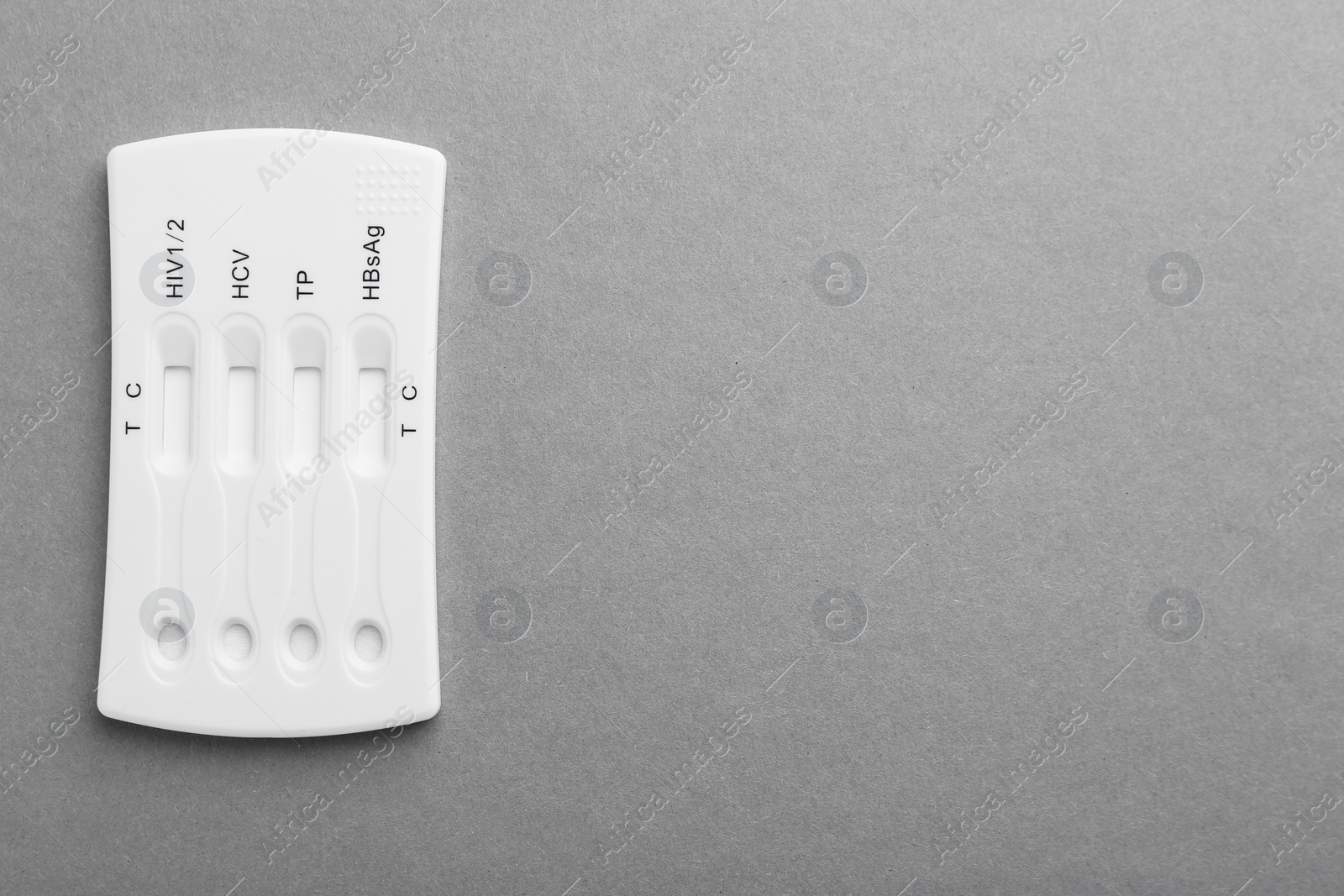 Photo of Disposable multi-infection express test on light grey background, top view. Space for text