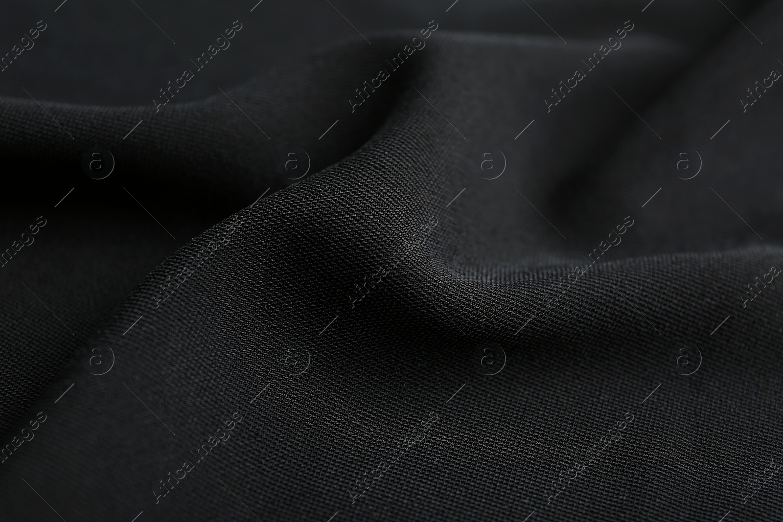 Photo of Texture of beautiful black fabric as background, closeup