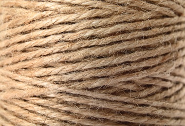 Photo of Spool with hemp rope, closeup. Organic material