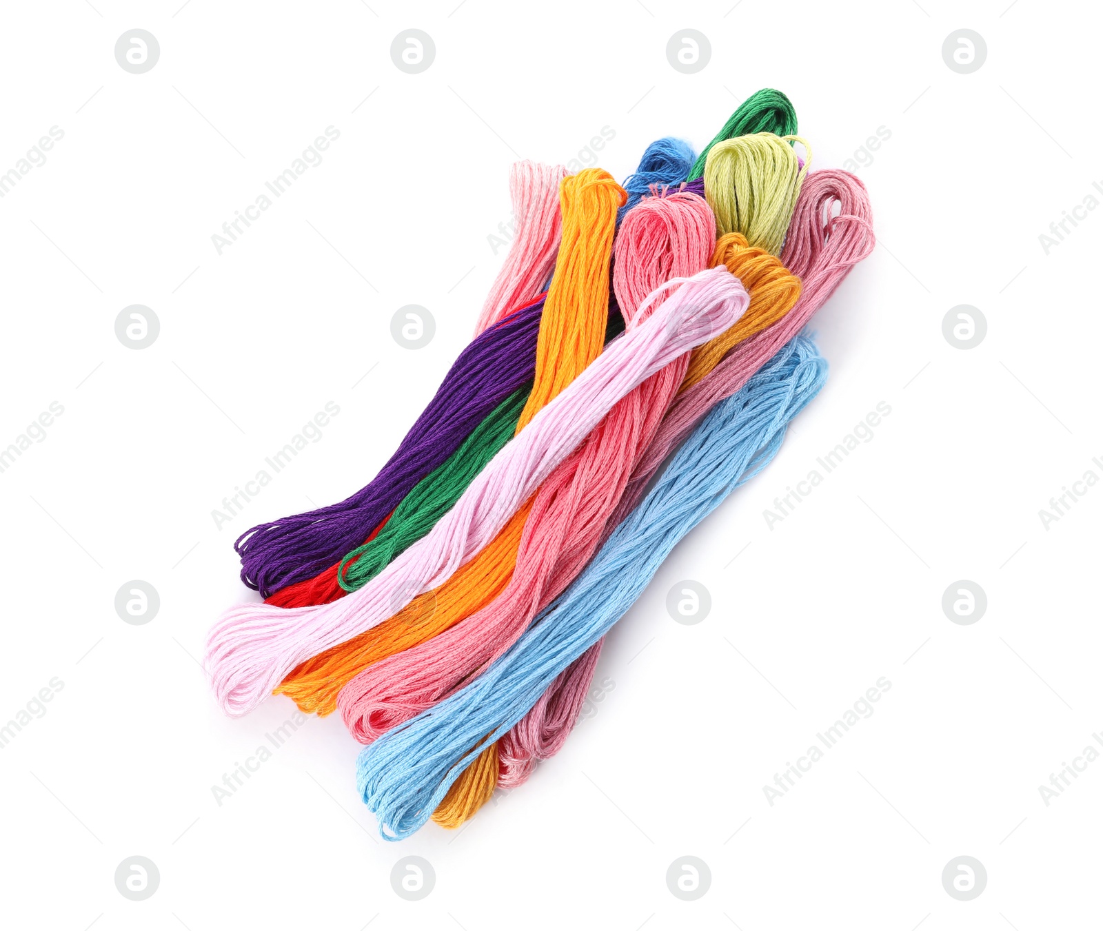 Photo of Colorful embroidery floss set on white background, top view