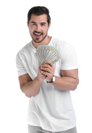 Handsome young man with dollars on white background