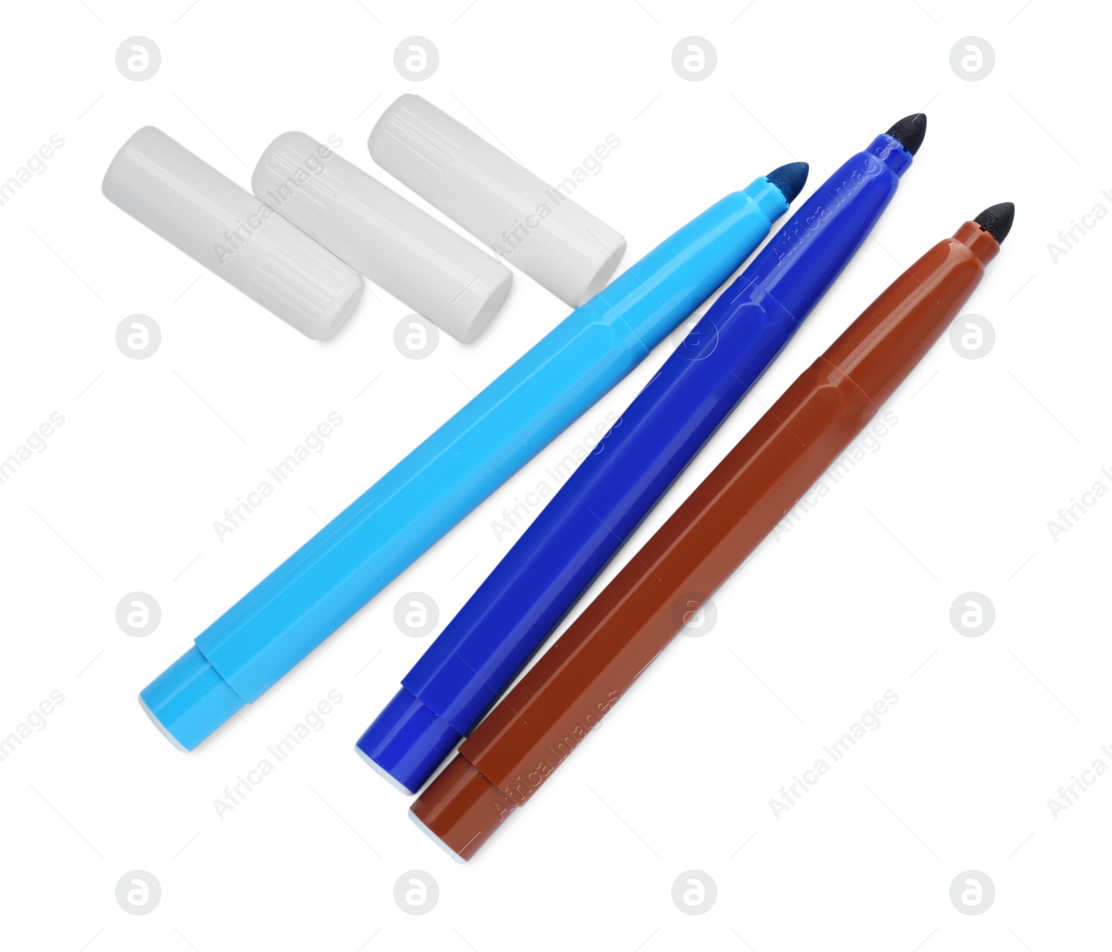 Photo of Different colorful markers and caps on white background, top view