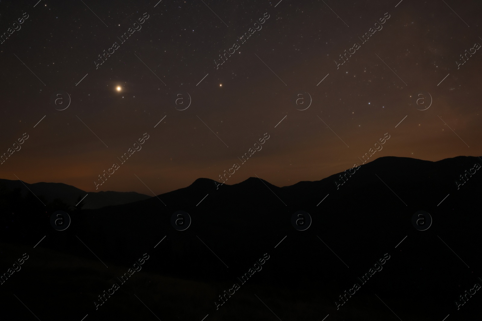 Photo of Picturesque view of mountain landscape and beautiful starry sky at night