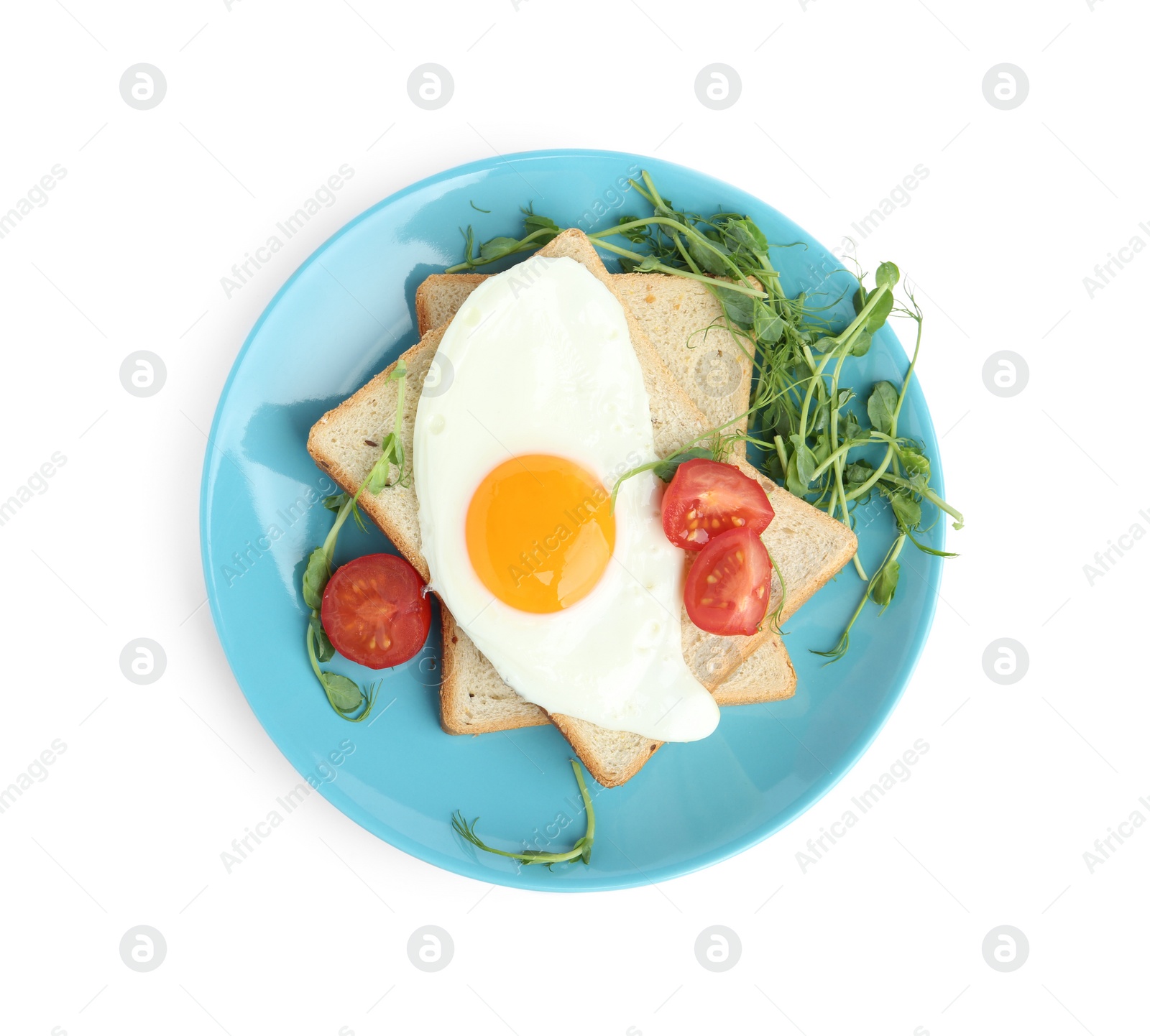 Photo of Tasty fried egg with bread and garnish isolated on white, top view