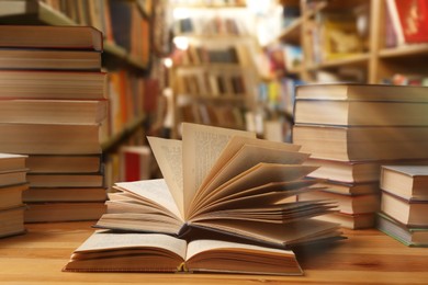 Image of Different books on wooden table in library