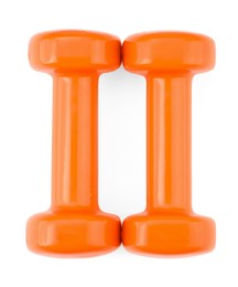 Orange dumbbells isolated on white, top view. Sports equipment