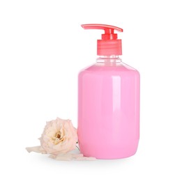 Photo of Dispenser with liquid soap and rose on white background