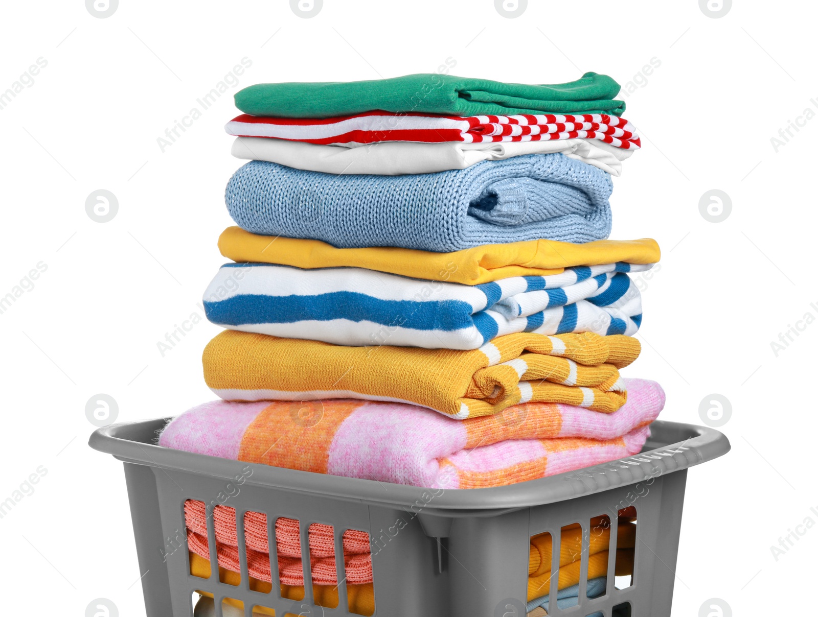 Photo of Plastic laundry basket with clean clothes isolated on white