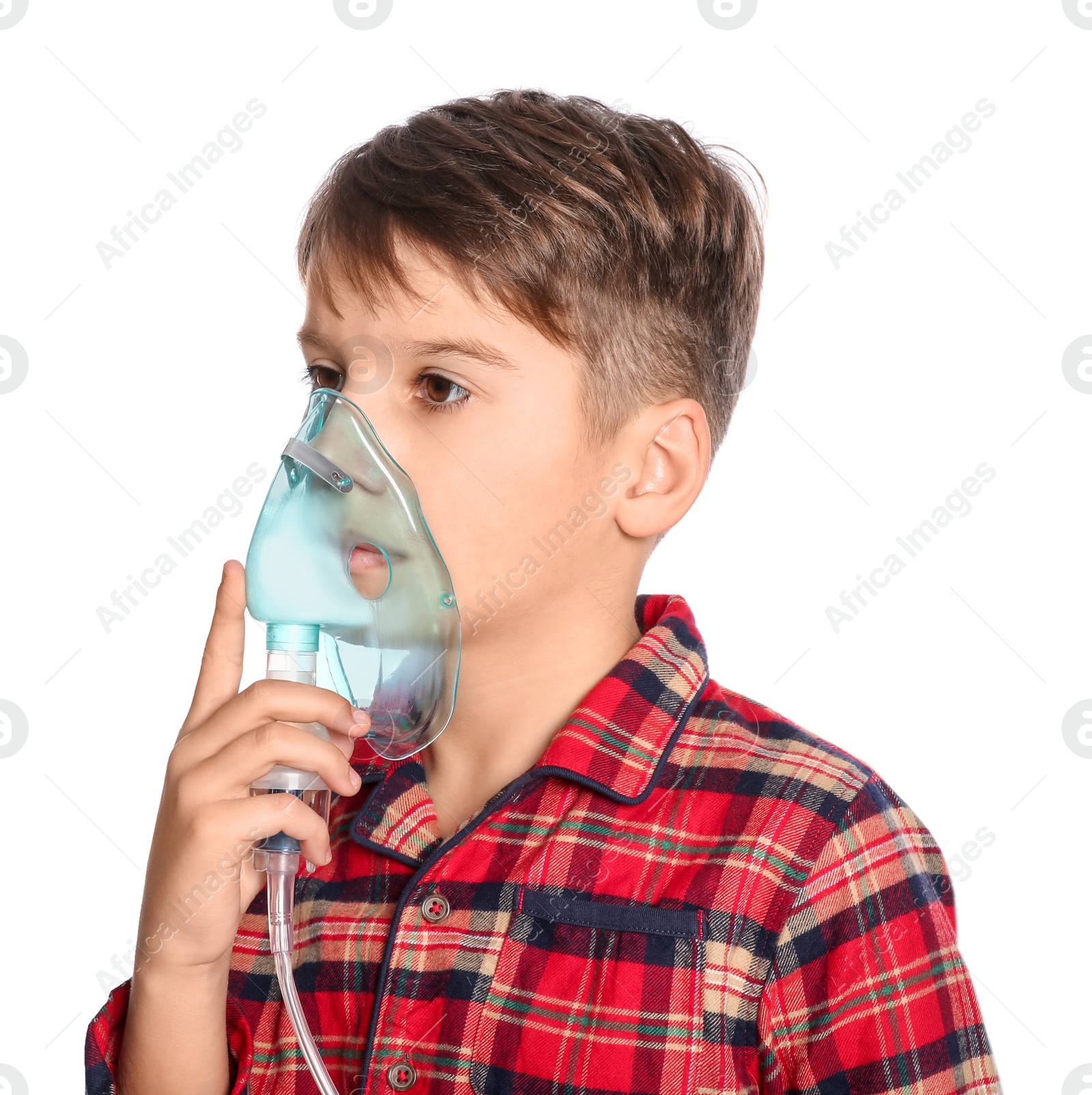 Photo of Boy using nebulizer for inhalation on white background