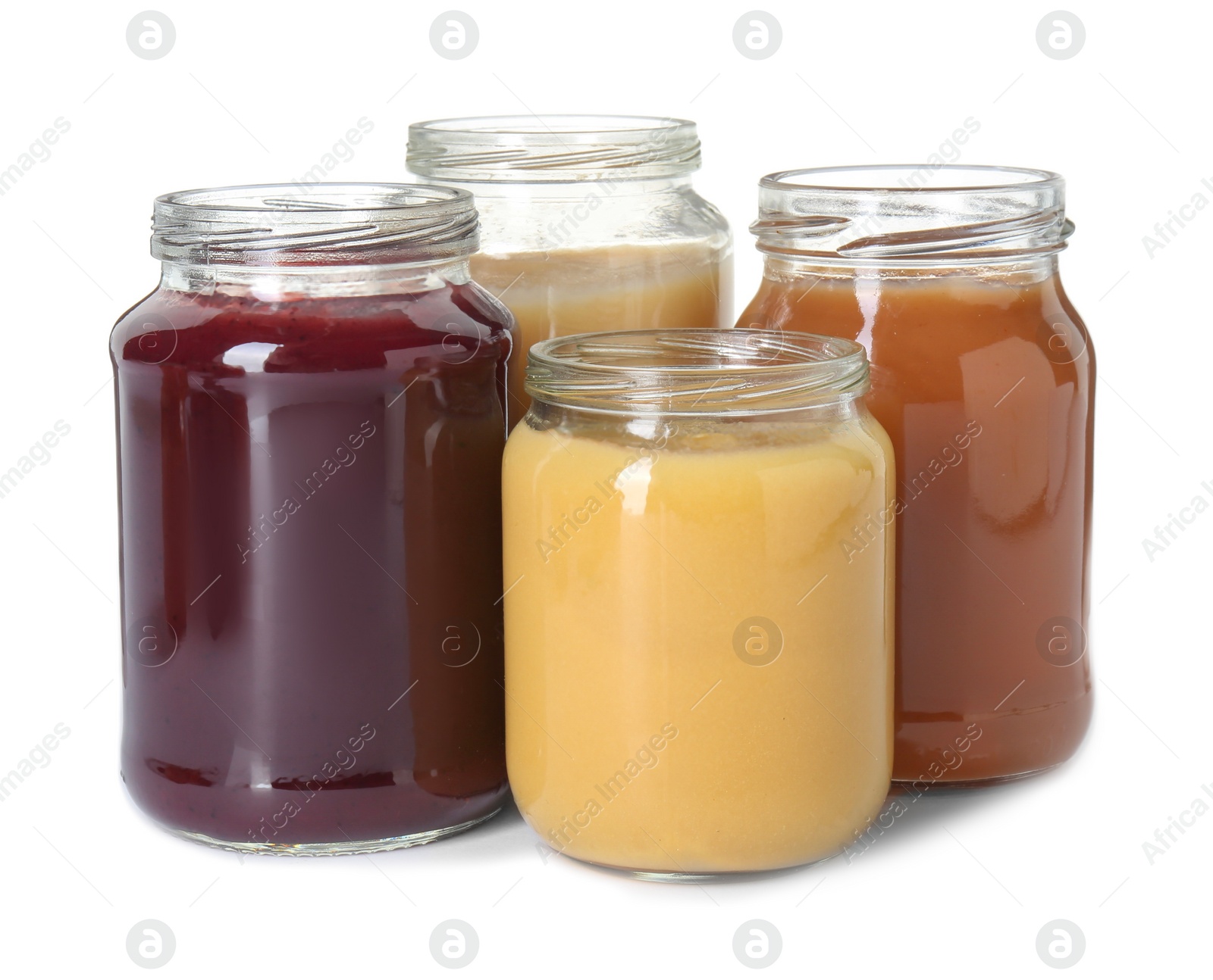 Photo of Baby food. Different healthy puree in jars isolated on white