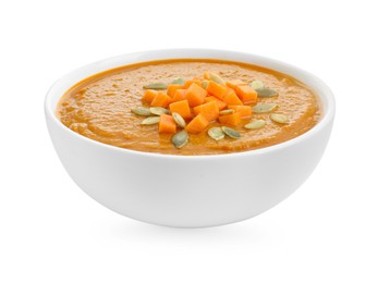 Delicious pumpkin cream soup with seeds in bowl isolated on white