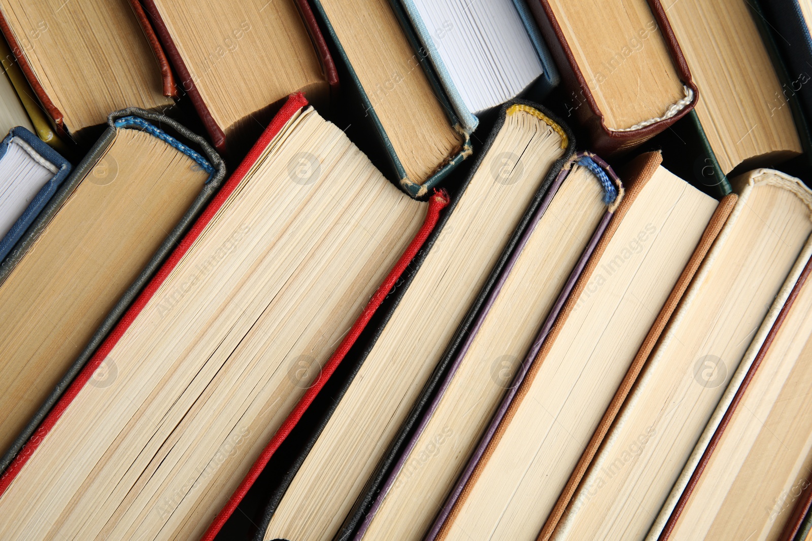 Photo of Many different hardcover books as background, top view