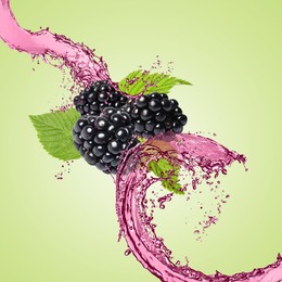 Image of Fresh blackberries and juice in air on light green background