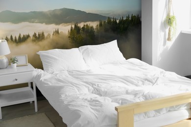 Image of Light bedroom. Interior with comfortable bed and mountain landscape wallpapers