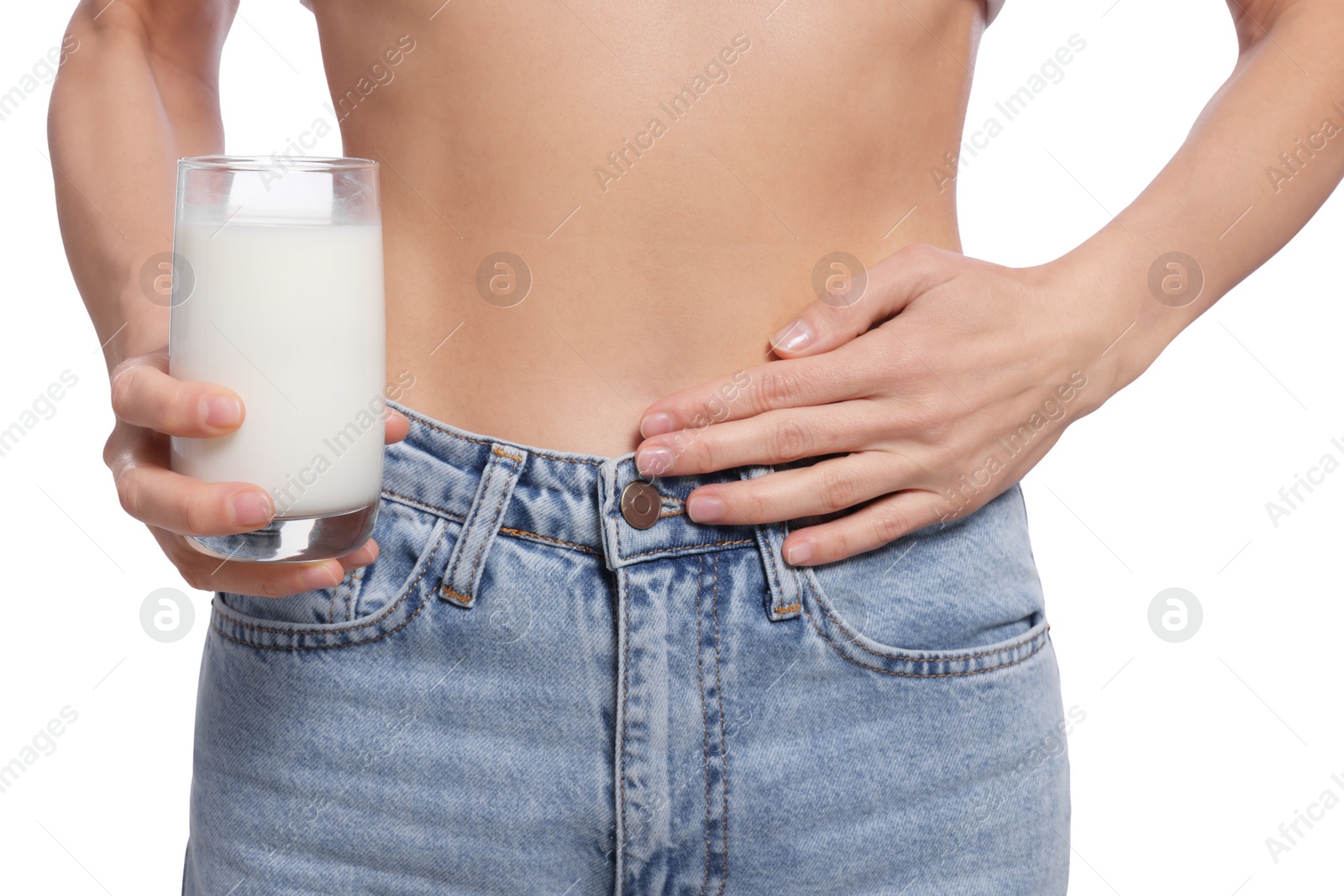 Photo of Woman with glass of milk suffering from lactose intolerance on white background, closeup