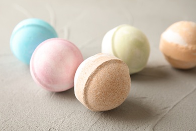 Colorful bath bombs on grey background. Spa product