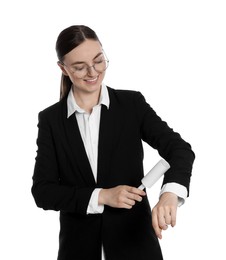 Young woman cleaning suit with lint roller on white background