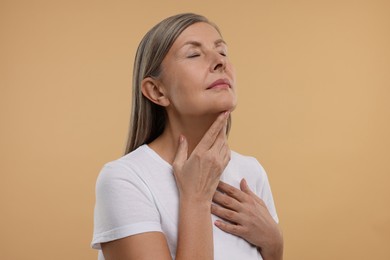 Photo of Beautiful woman with healthy skin on beige background