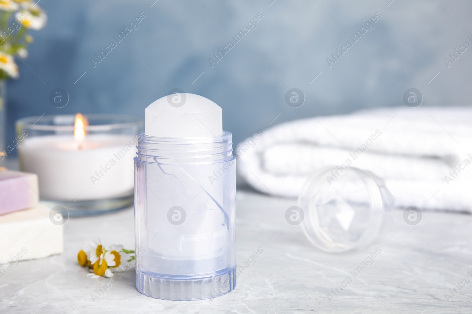 Photo of Natural crystal alum deodorant on light grey marble background