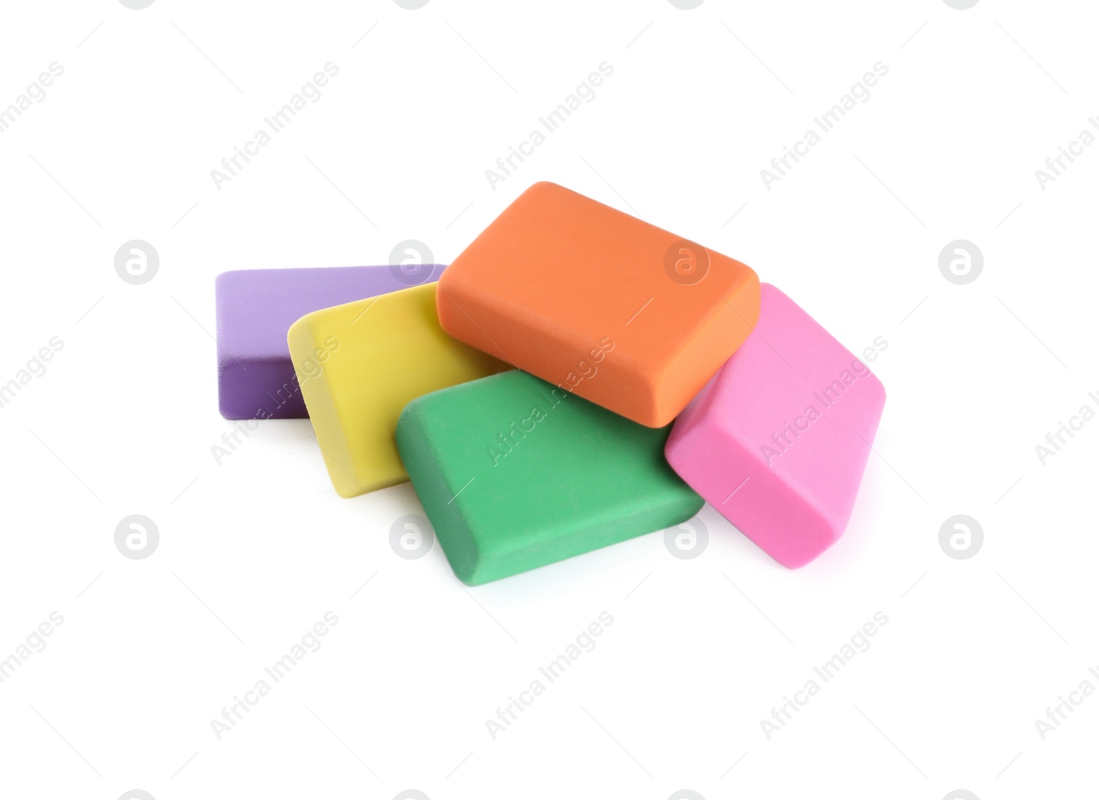 Photo of Pile of bright erasers on white background