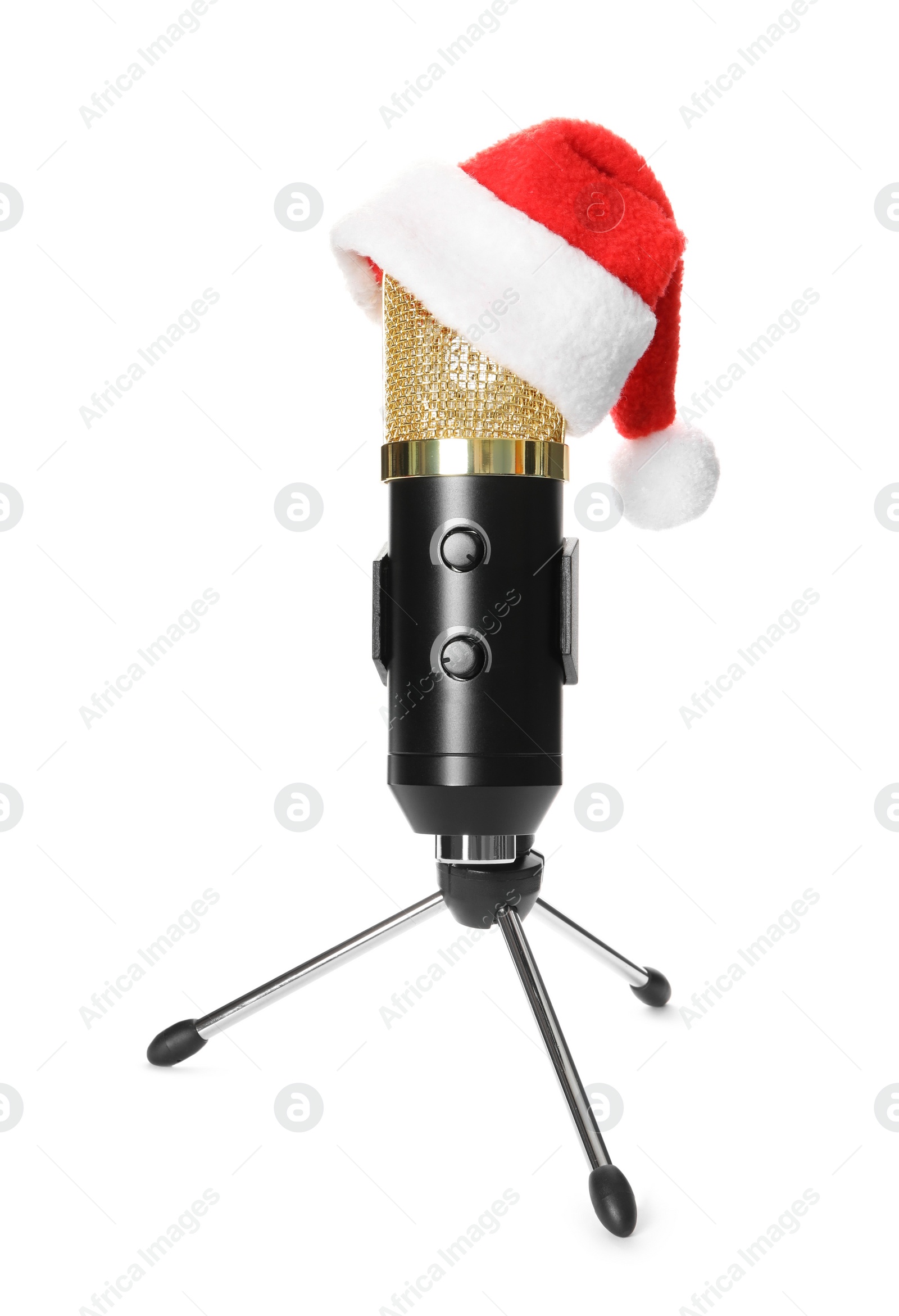 Photo of Microphone with Santa hat isolated on white. Christmas music