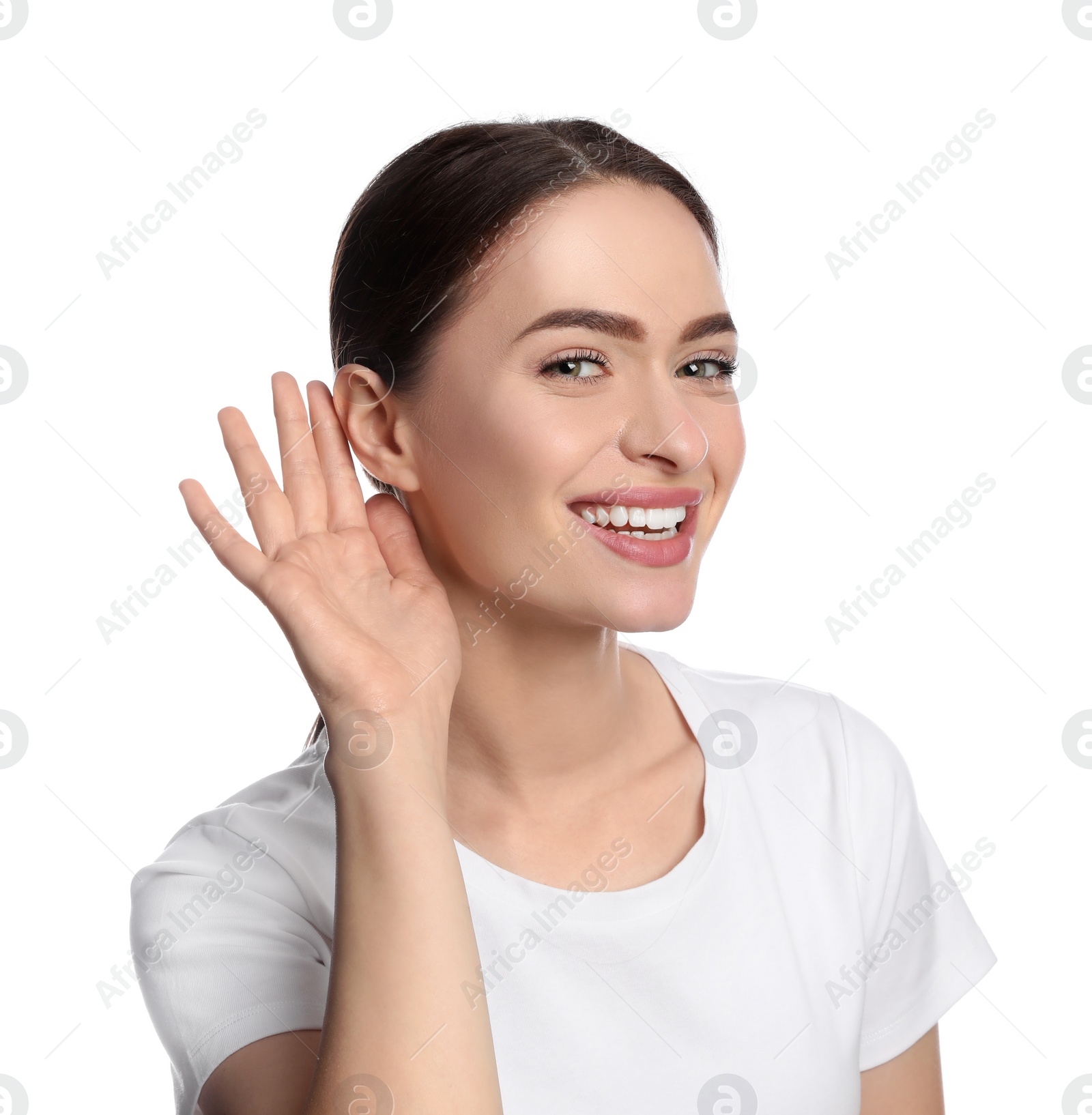 Photo of Young woman showing hand to ear gesture on white background