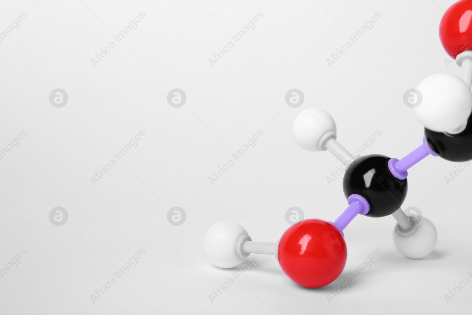 Photo of Molecule of vitamin C on white background, closeup. Chemical model