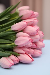 Photo of Bouquet of beautiful pink tulips on light grey background, closeup