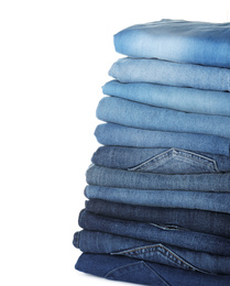 Stack of different jeans isolated on white