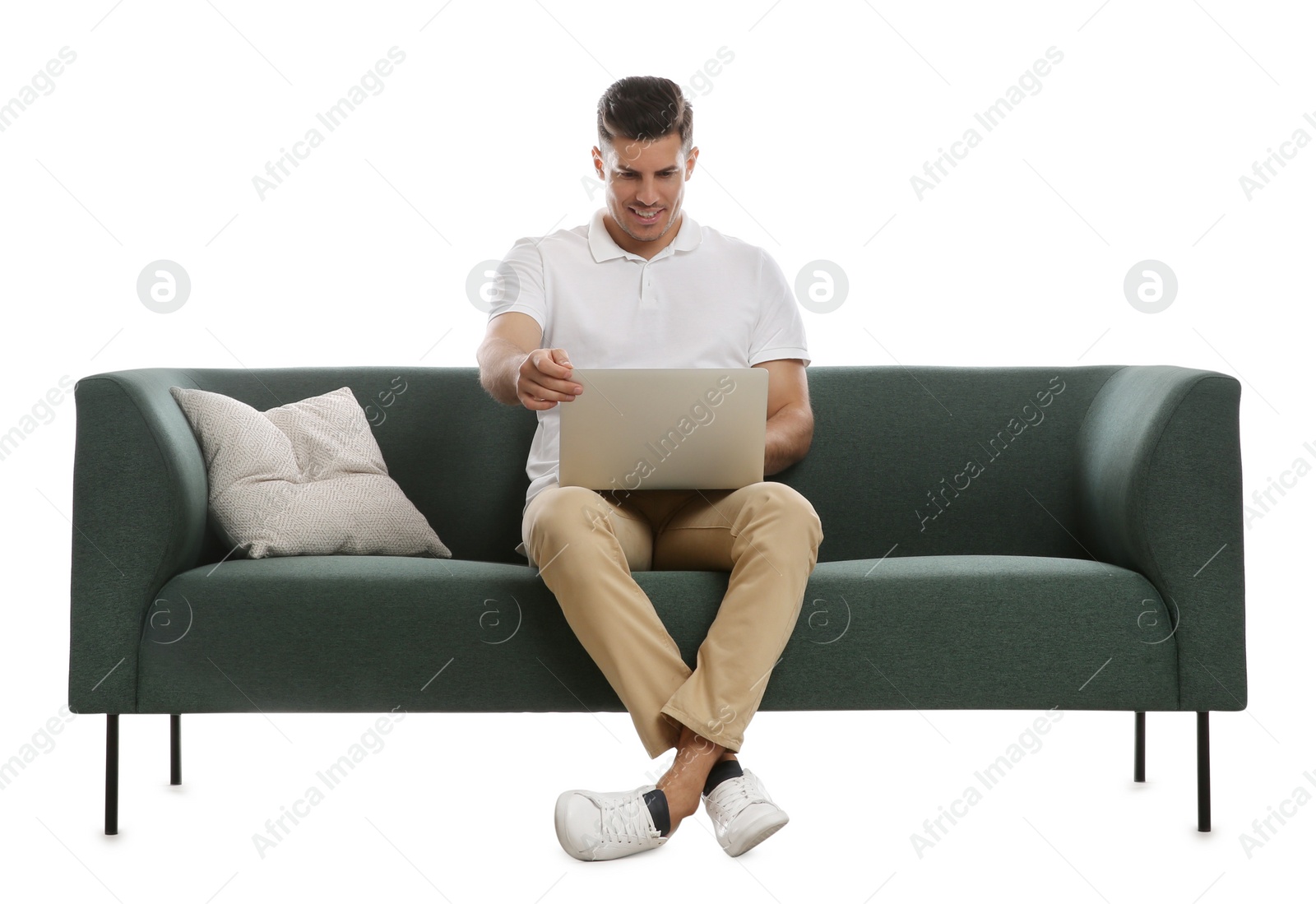 Photo of Man with laptop on comfortable green sofa against white background