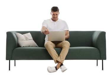 Photo of Man with laptop on comfortable green sofa against white background