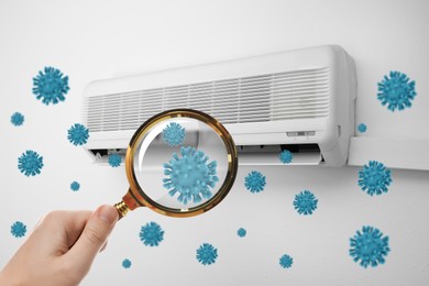 Image of Spreading of viruses. Woman with magnifying glass and contaminated air conditioner on white wall indoors