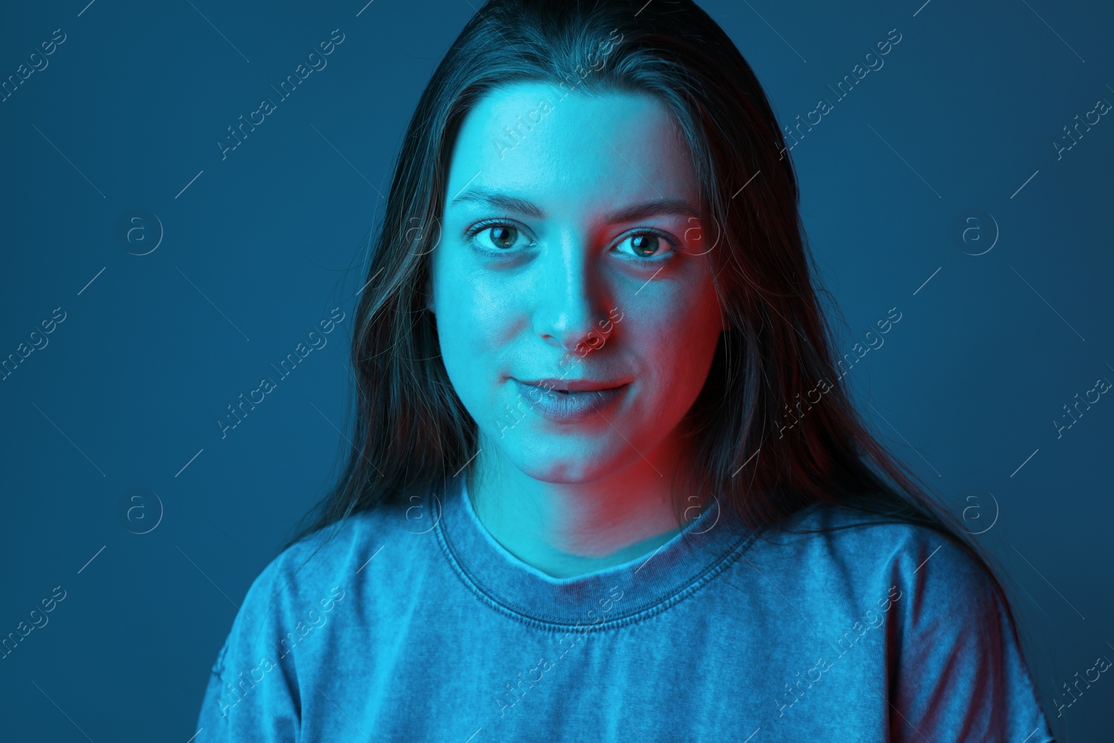 Photo of Portrait of beautiful young woman on color background