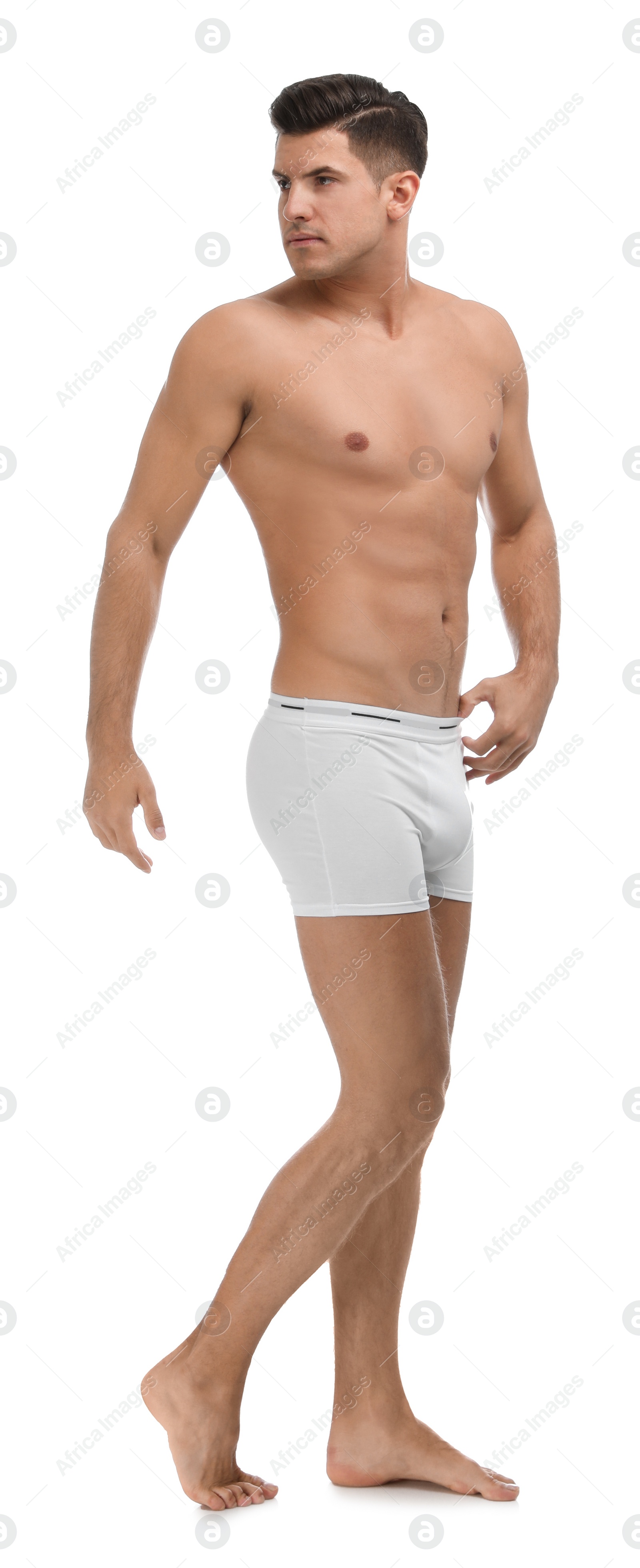 Photo of Handsome man in underwear on white background