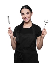 Photo of Portrait of happy hairdresser with professional scissors and comb on white background