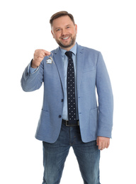 Real estate agent holding key on white background