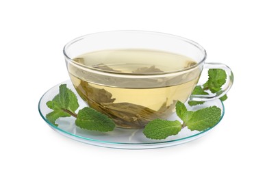 Photo of Refreshing green tea in cup and mint leaves isolated on white
