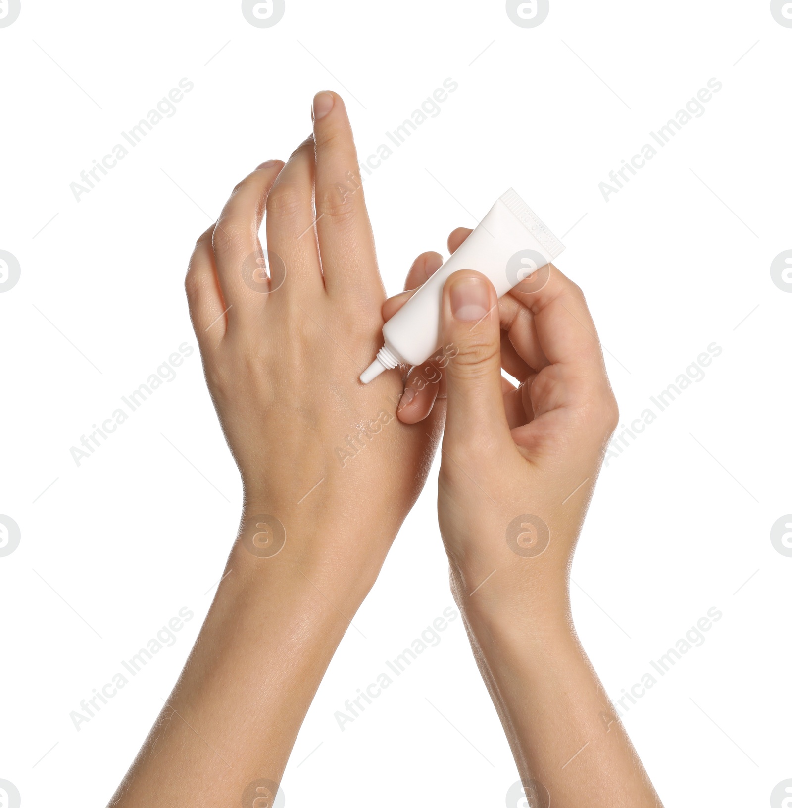 Photo of Woman applying cream from tube on hand against white background, closeup